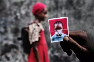 Photo of a girl in a red dress and a 3x4 photo is one of the finalists in the contemporary African photography competition CAP Prize 2023