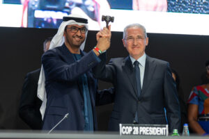 Sultan al-Jaber, President of COP28, passes the gavel used to open and close the COP to Mukhtar Babayev, President of COP29 in Azerbaijan