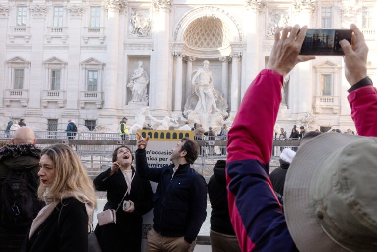 Who gets the millions of euros in coins thrown into the Trevi Fountain in Rome?
