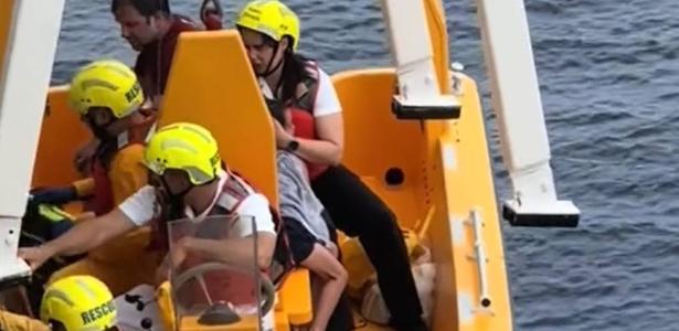 Child who fell by ship posed for a photo in a rack, says witness