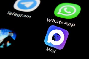 Smartphone screen with Telegram and WhatsApp shortcut icons, limited in Russia, and State Russian application Max