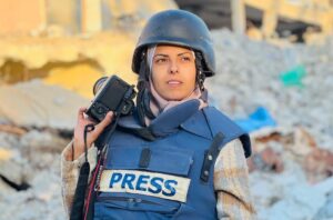 Palestinian journalist Mariam Abu Dagga wearing Blue Press vest, Jvimeth in an attack from Israel to Nasser Hospital